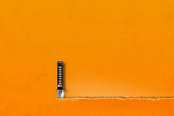The sword cuts the orange leaf