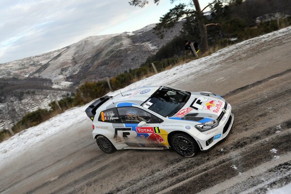 Volkswagen polo car on the background of mountains