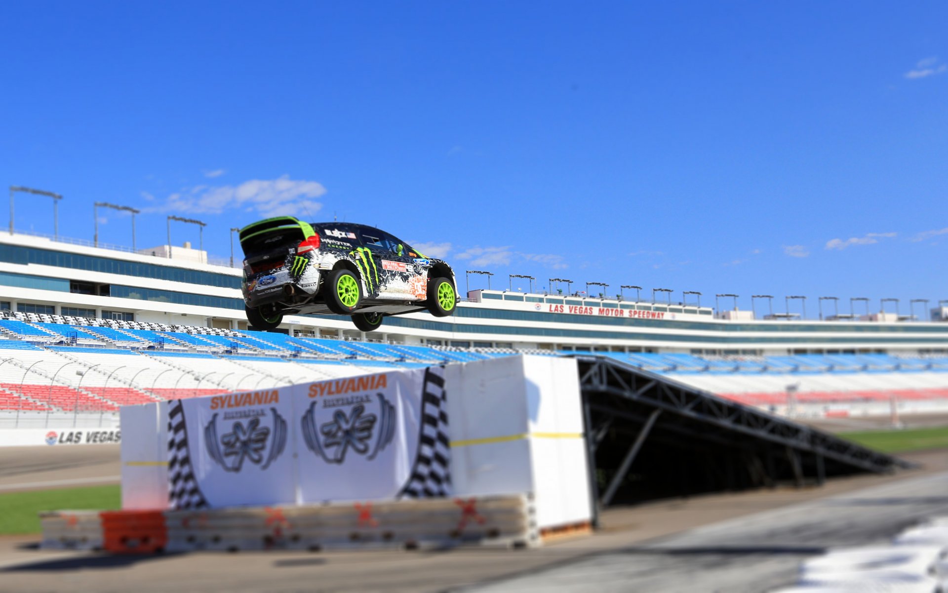 ford fiesta rally ken block rallycross car in the air speed machine people tribune day tilt-shift