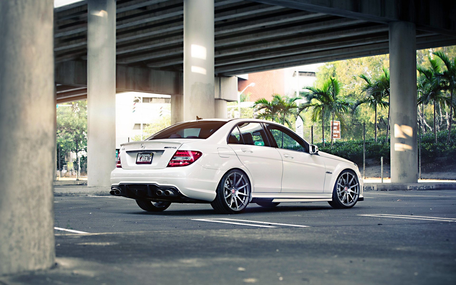 mercedes mercedes-benz sedan c63 amg tuning power white wheels street palm road bridge