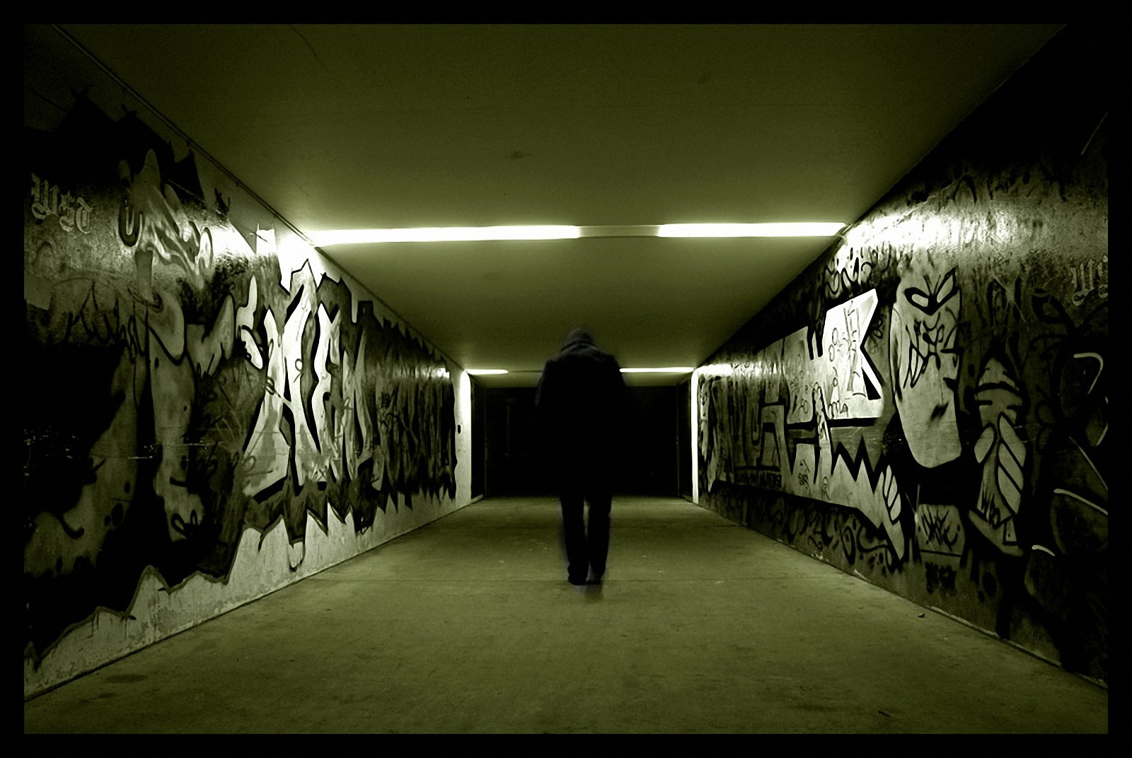 man graffiti corridor