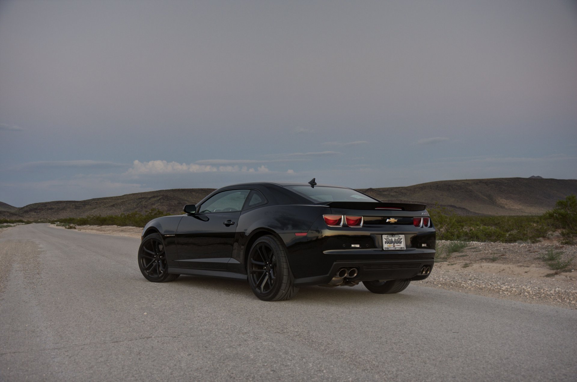 chevrolet camaro zl1 black wheels chevrolet camaro zl1 rear view black wheels road grass slope horizon line