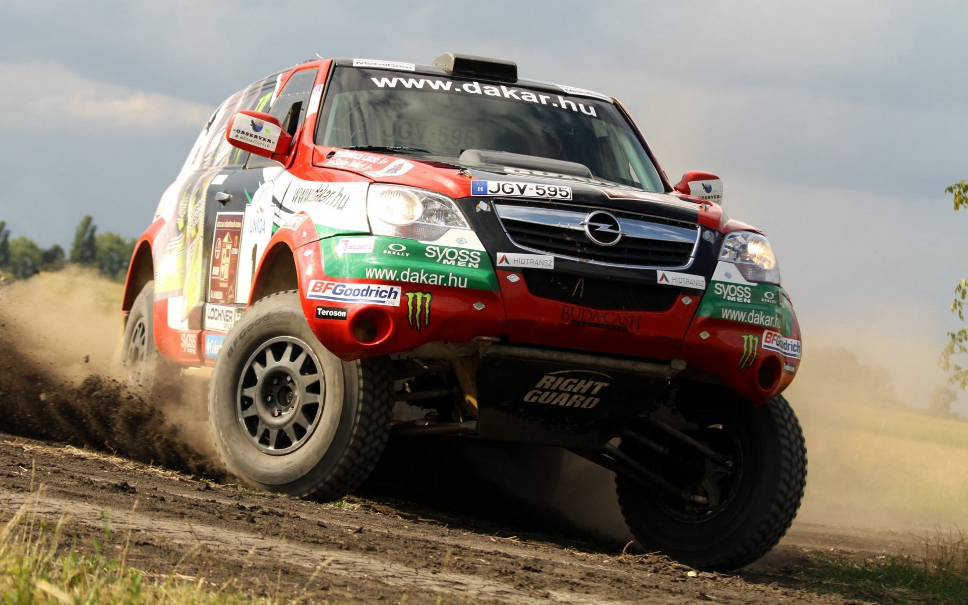 opel dakar rally auto suv frente logotipo deporte coche faros derrape giro día rally ruedas en movimiento jeep