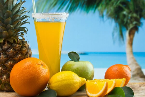 Fruit cocktail on a sandy beach