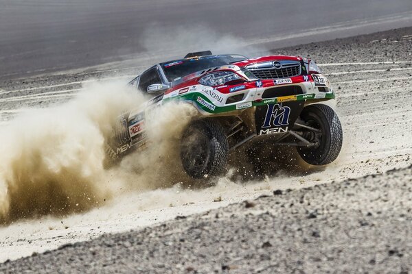 SUV on the background of dust with big wheels