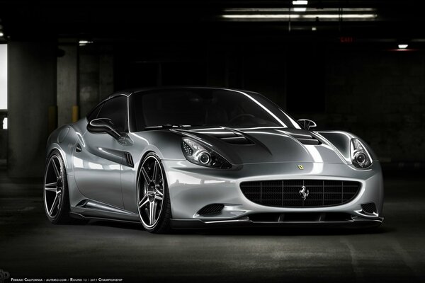 Silver Ferrari California with tuning on a dark background