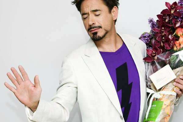 Actor Robert Downey Jr. with a bouquet of flowers