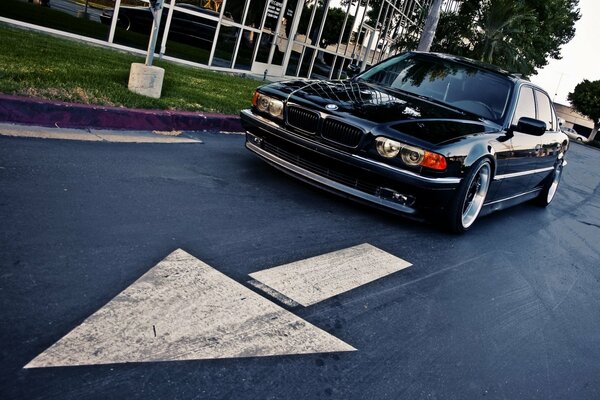 Black BMW 740 E38 car on the road