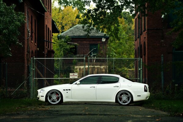 Maserati Quadroporte car on the background of a rural landscape