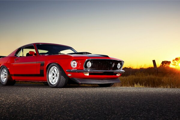 A real man s car mustang at sunset