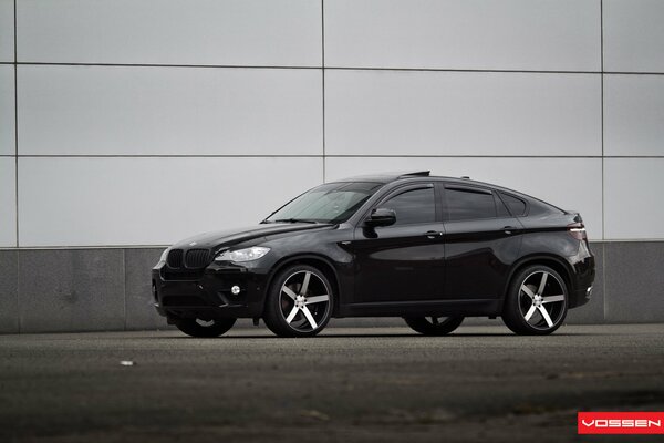 Black BMW Jeep with tinted windows