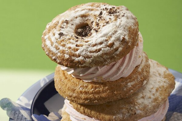 Dessert of custard cookies sprinkled with powdered sugar