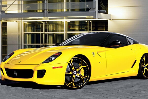 Ferrari asanti yellow near the building