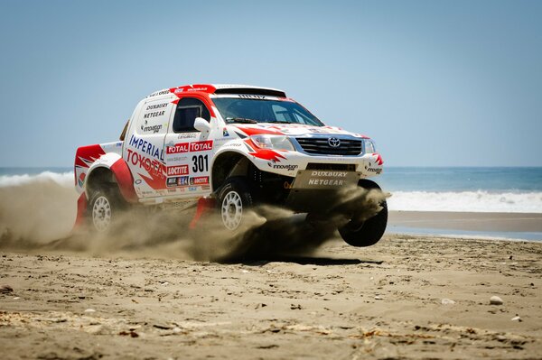 Toyota in Dakar on sea sand