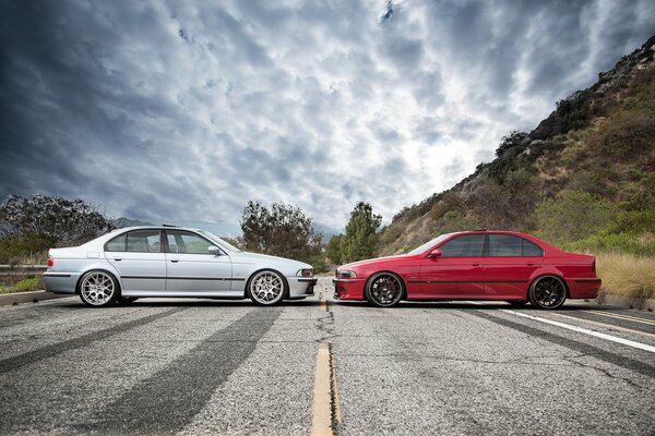 Red BMW opposite grey BMW