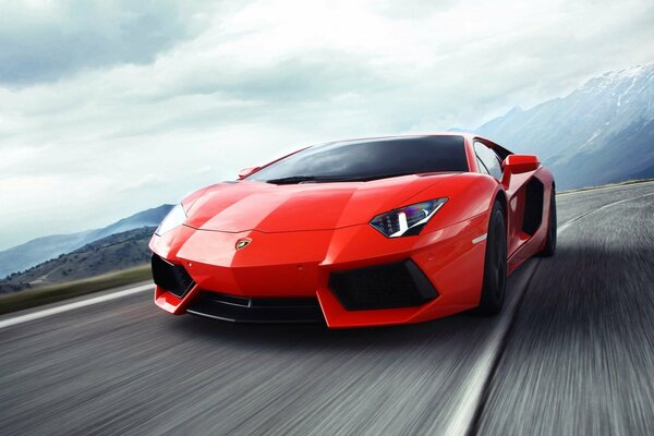 Red lamborghini in motion on the road