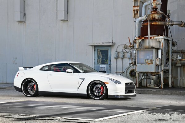 A white car near the building