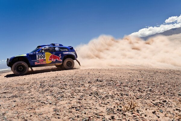 A blue SUV car on a dust background