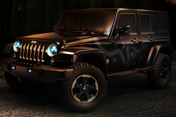 Jeep rangler in semi-darkness with headlights