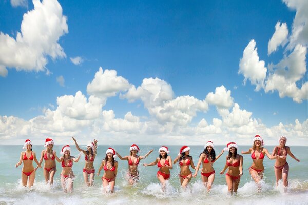 People in the middle of a sea wave against the sky