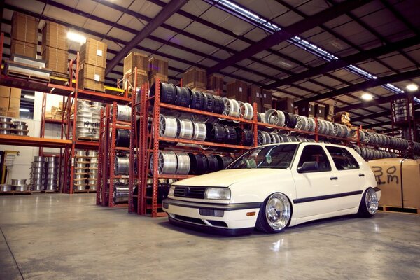 An ordinary white Volkswagen in the garage