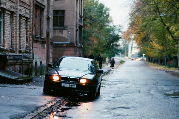 Black bmw boomer on the street near the house