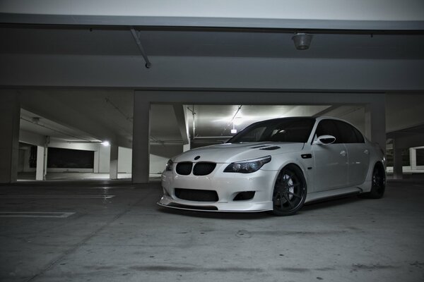 White BMW M5 in the parking lot. Front view