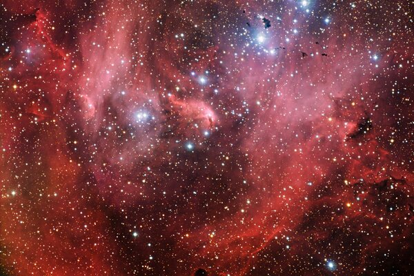 Spazio stellare infinito dell universo. Miliardi di stelle e pianeti su uno sfondo rosso-bordeaux