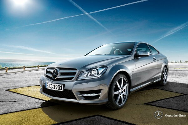 Mercedes silver color on a blue sky background