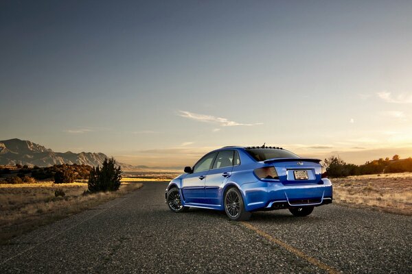 Subaru impreza on the background of the road