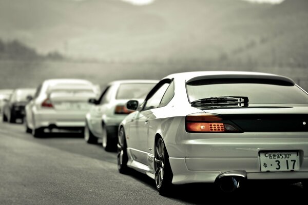 Nissan in a traffic jam of white cars