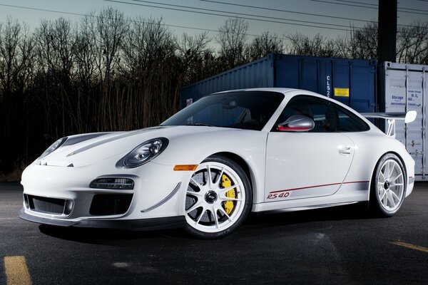 Supercar white car on gray asphalt