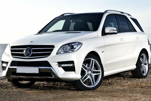 Beautiful white Mercedes on the background of the sea