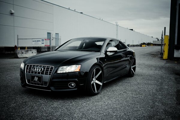 Black Audi on a gray background