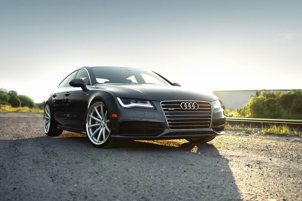 Photo of Audi on the background of a beautiful landscape