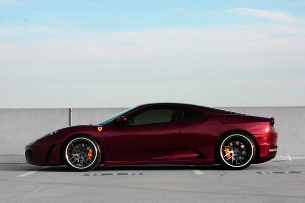 Red Ferrari with black wheels Car