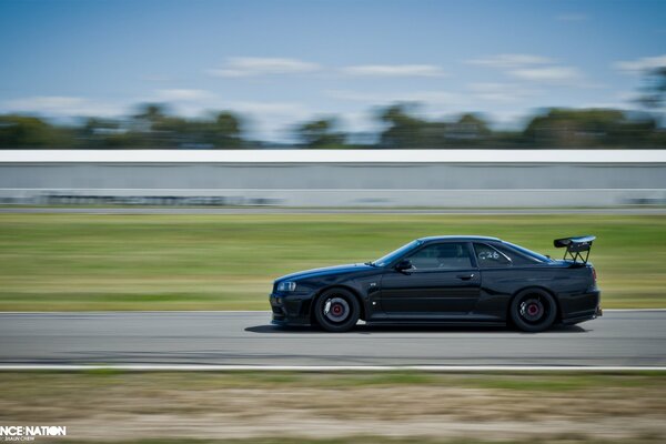 Black GT-R in motion at speed