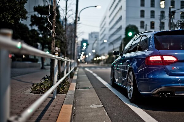 Blue Audi s-4 station wagon on the city street