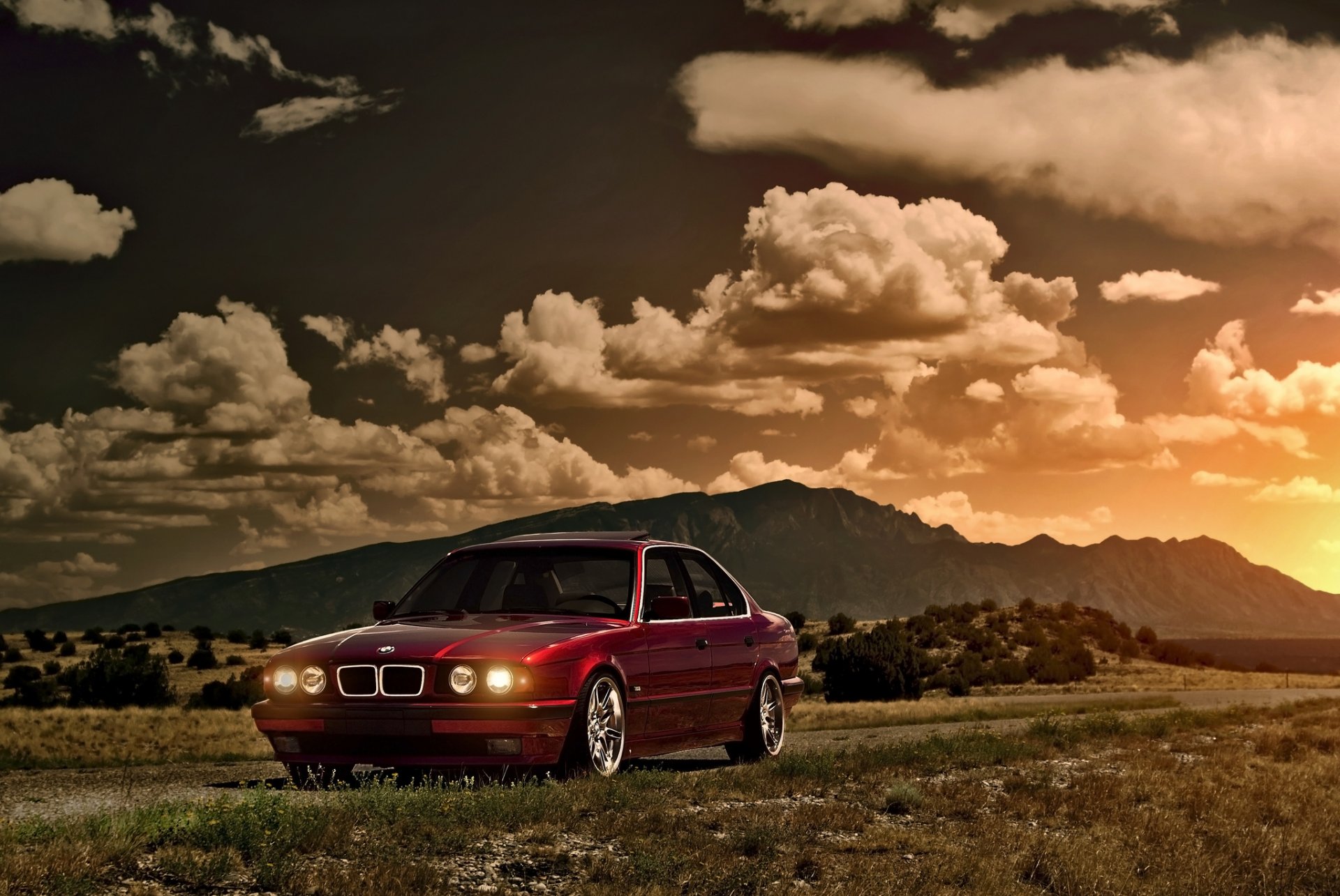 bmw 5 series e34 red front bmw red sun sunset glare sky clouds mountain