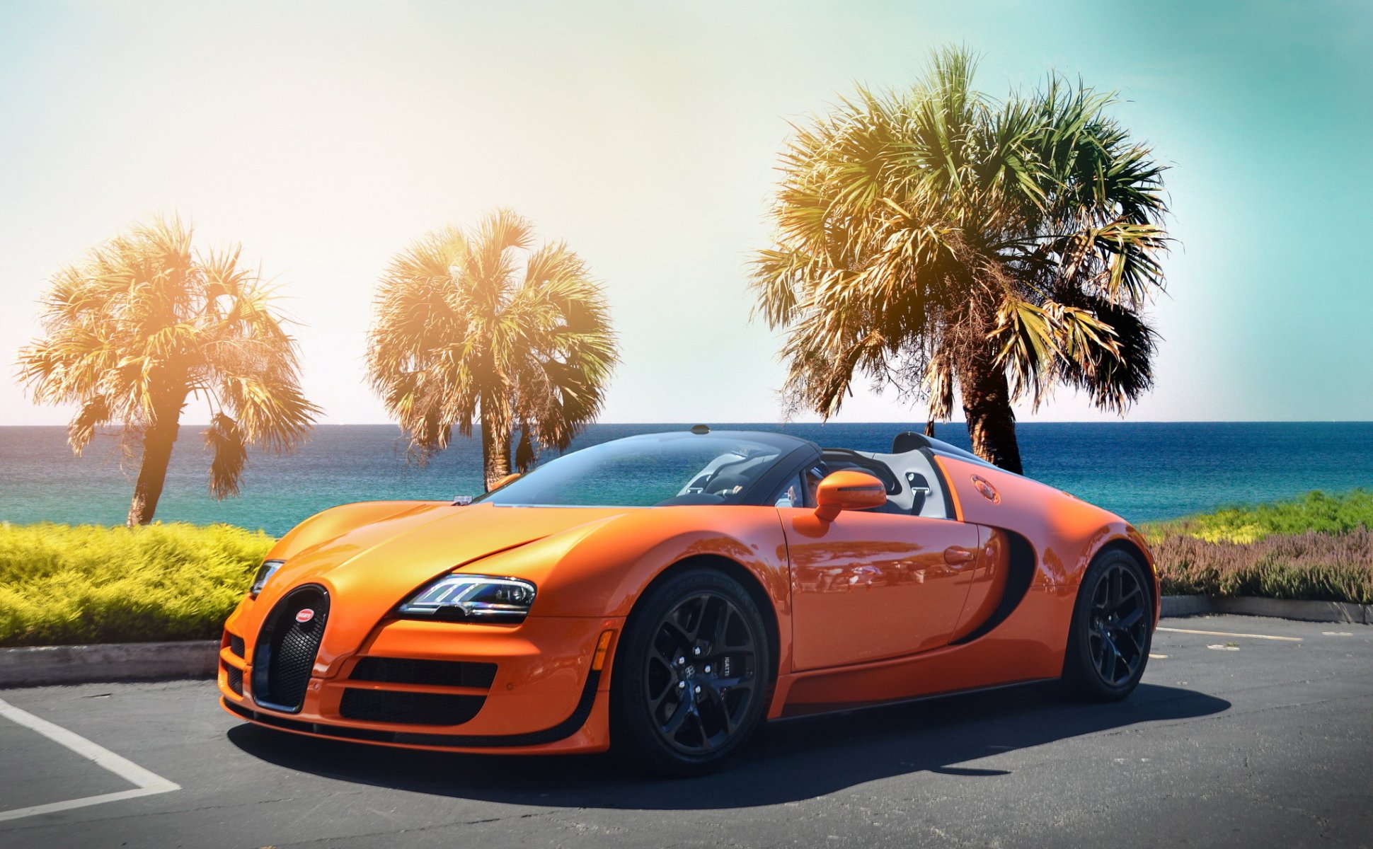 bugatti veyron hipercoche naranja playa palmeras