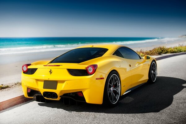 Tuning yellow Ferrari near the Italian sea