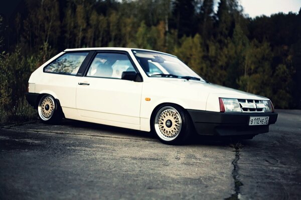 White Lada on the background of the forest