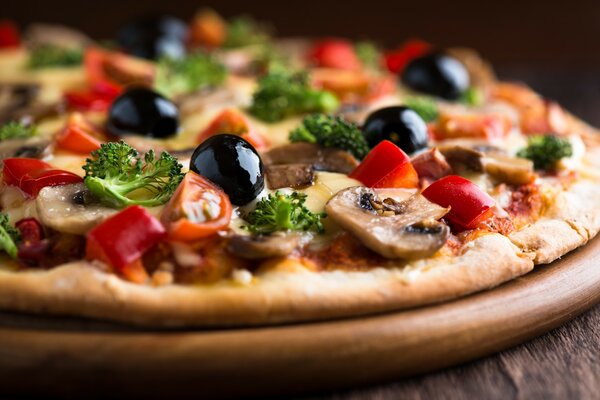 Pizza with olives, parsley and mushrooms