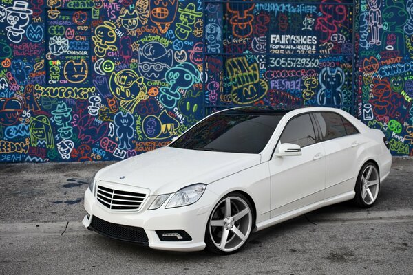 White tuned Mercedes-Benz executive class car