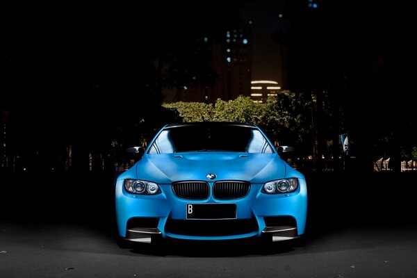 Blue car on a dark evening