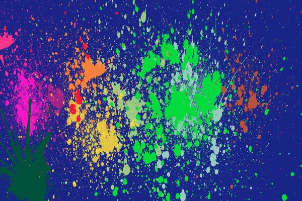 Splashes of multicolored colors on a blue background