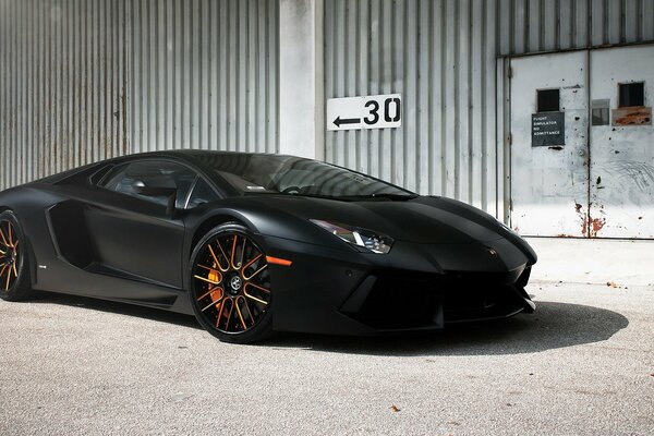 Lamborghini, on the background of a metal hangar