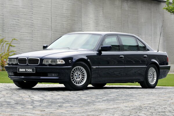 BMW car on the background of a concrete wall