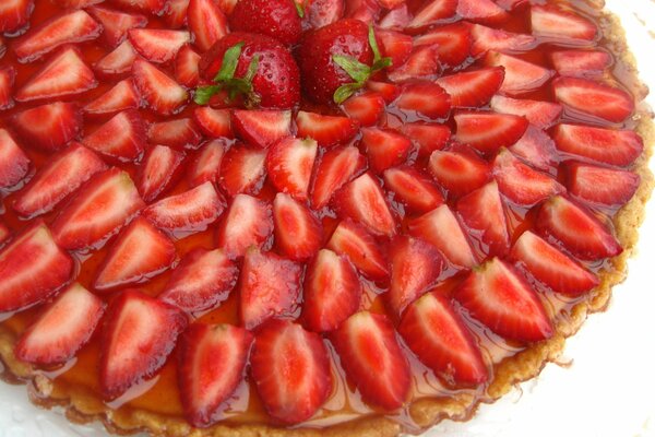 Cake decorated with strawberries and caramel