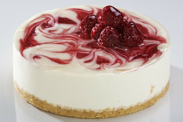 Cheesecake with raspberries and cream for breakfast